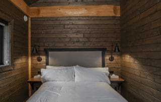 Bedroom in custom built twin eagle log cabin kits