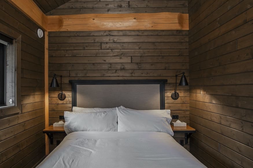Bedroom in custom built log cabin kit.