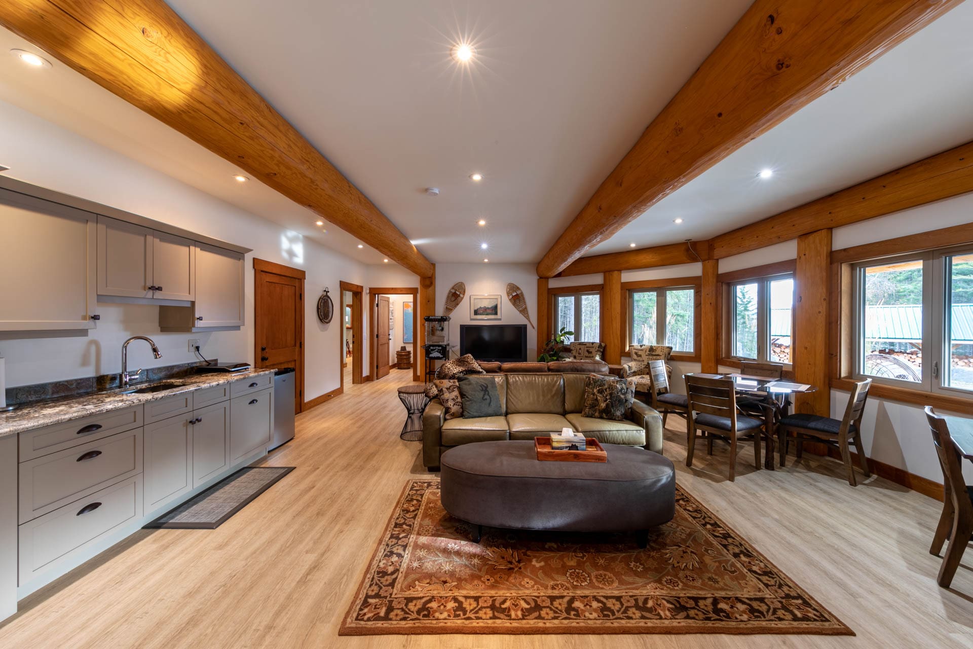 kitchen and living area of post and beam log home.