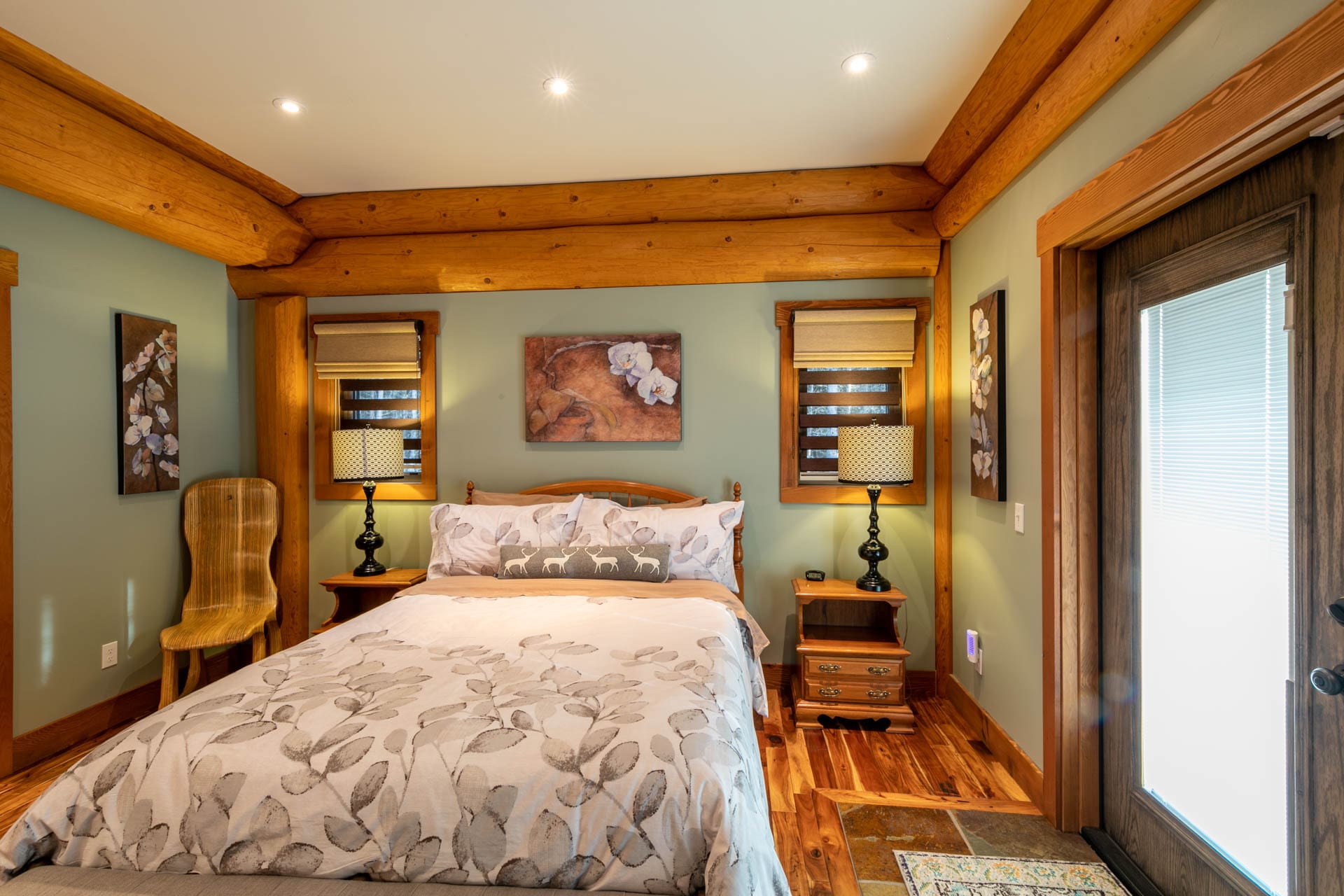 British Columbia Log Home builder bedroom in custom built Timber Frame Post and Beam Log home.