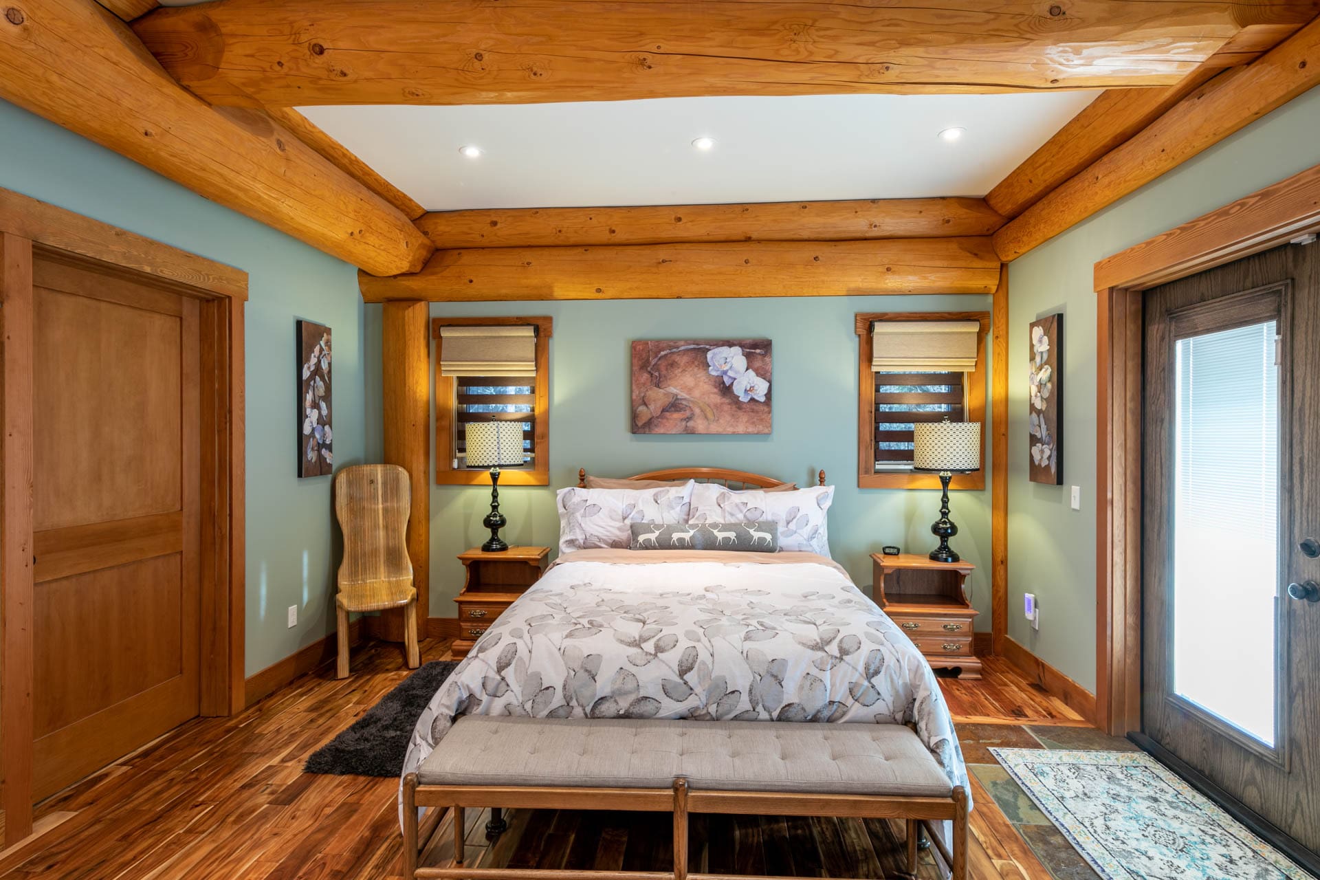 British Columbia Log Home builder bedroom in Timber Frame Post and Beam Log home.