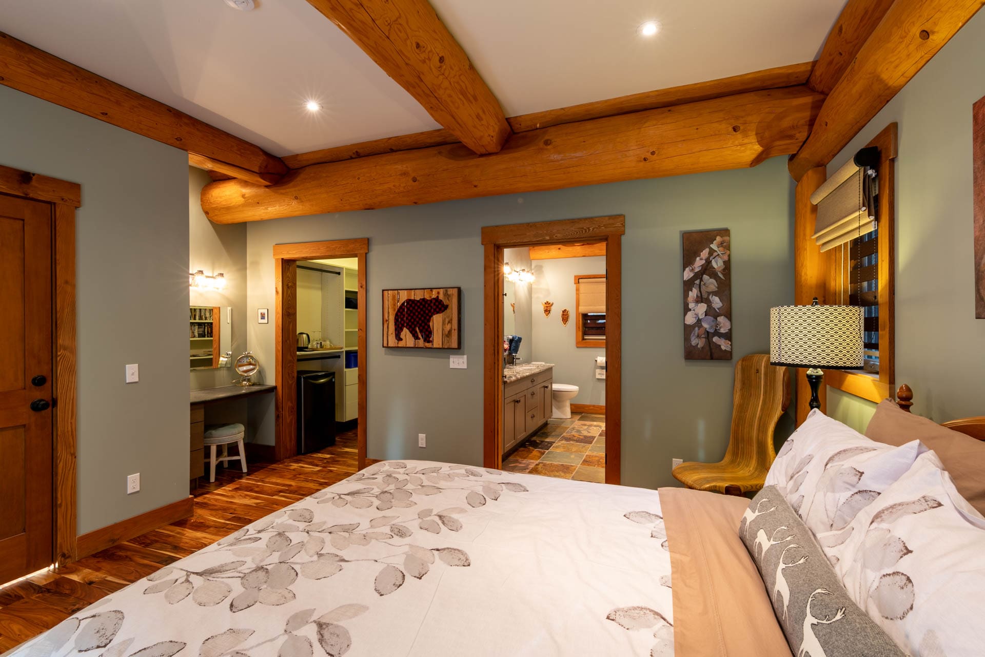bedroom and ensuite in Golden Acres Custom built post and beam log home in British Columbia.